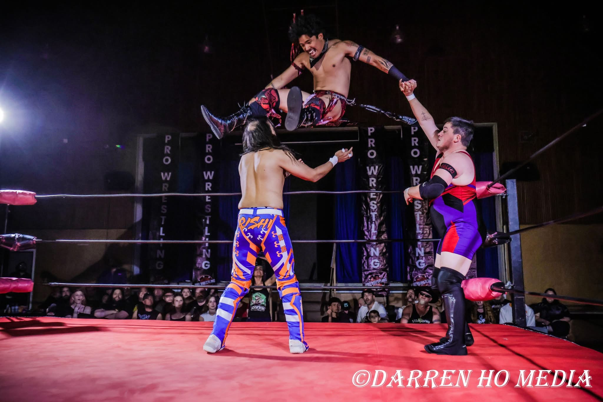 Wrestlers battling in the ring with 365 Pro Wrestling fans watching ringside